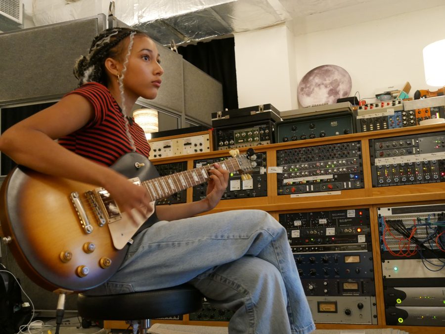 Nandi with a Les Paul guitar